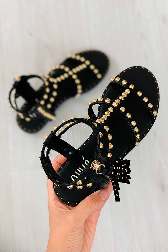Ovyé - Black sandals with gold studs and tassel
