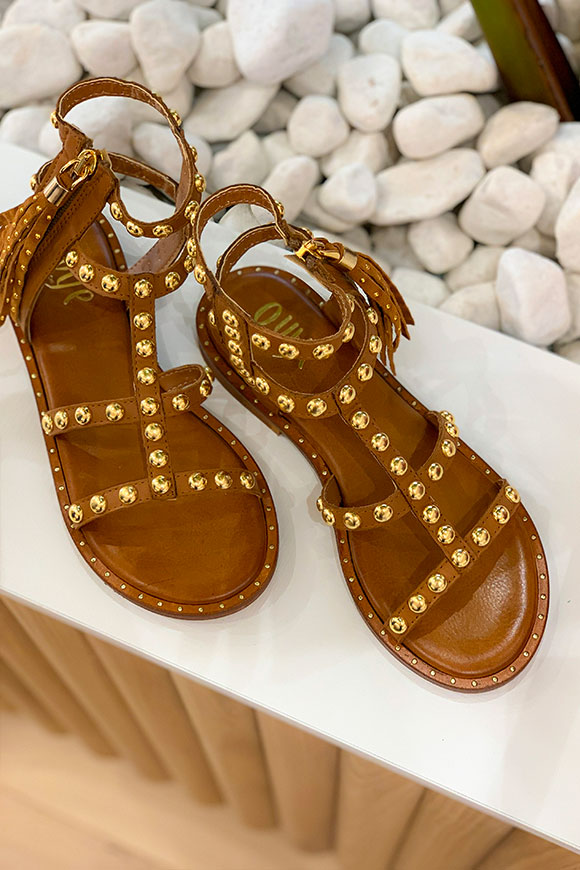 Ovyé - Gladiator leather sandal with gold studs