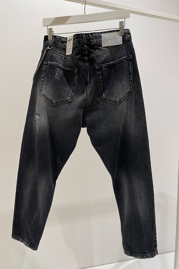 Berna - Jeans nero slavato con rotture e catena brunita