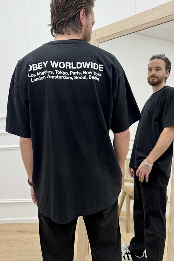 Obey - T shirt nera stampa "obey worldwide" in bianco