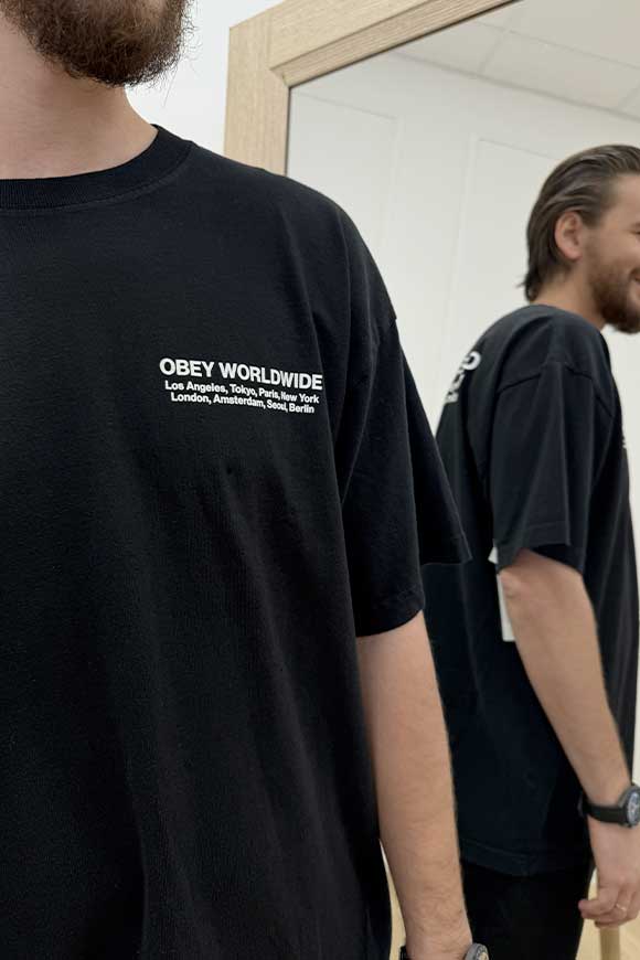 Obey - T shirt nera stampa "obey worldwide" in bianco